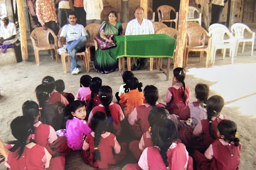 Hirabhai And Madhuben Sitting In Front Of The Students.